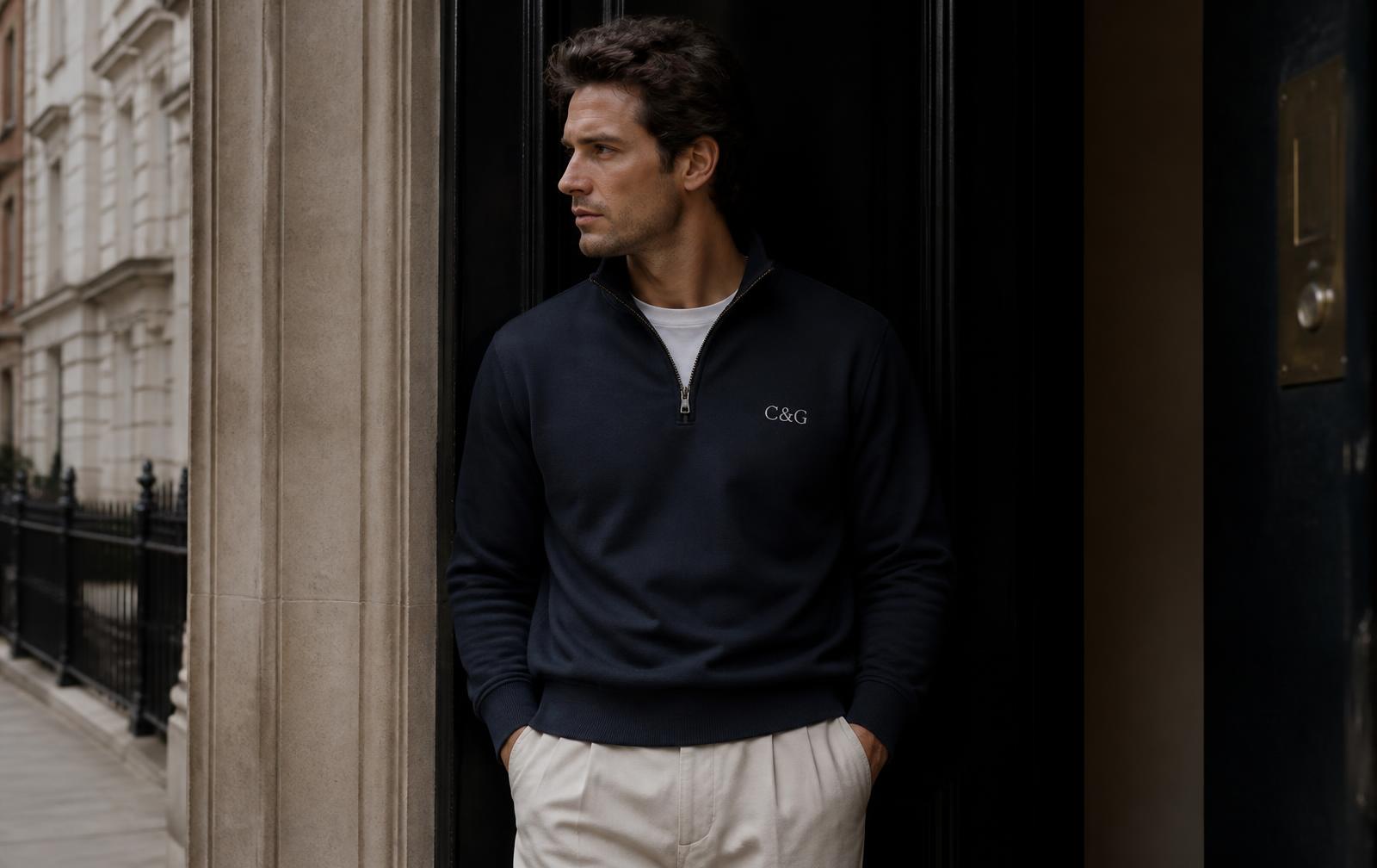 Model in a navy Cloth & Glitter quarter zip with an ivory chest glint